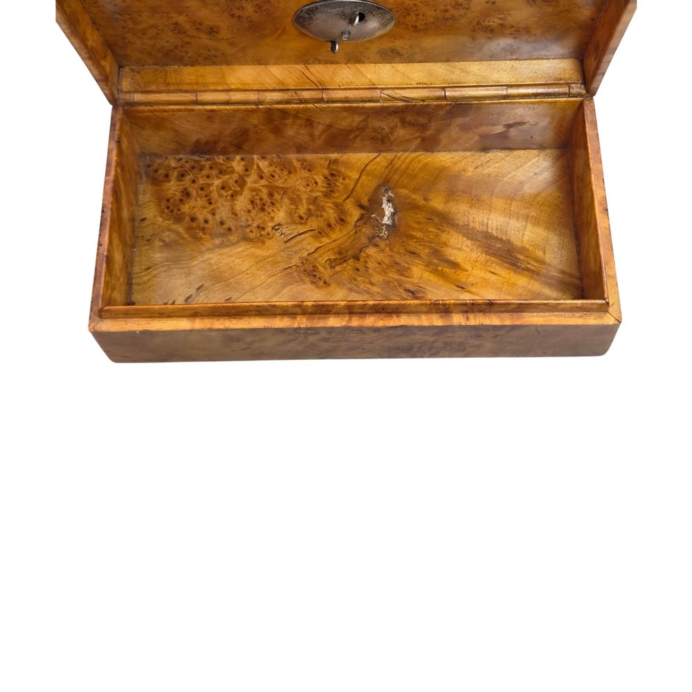 A rectangular Karelian birch box featuring a prominent silver and enamel Imperial Russian regimental badge mounted centrally on the lid. View XI