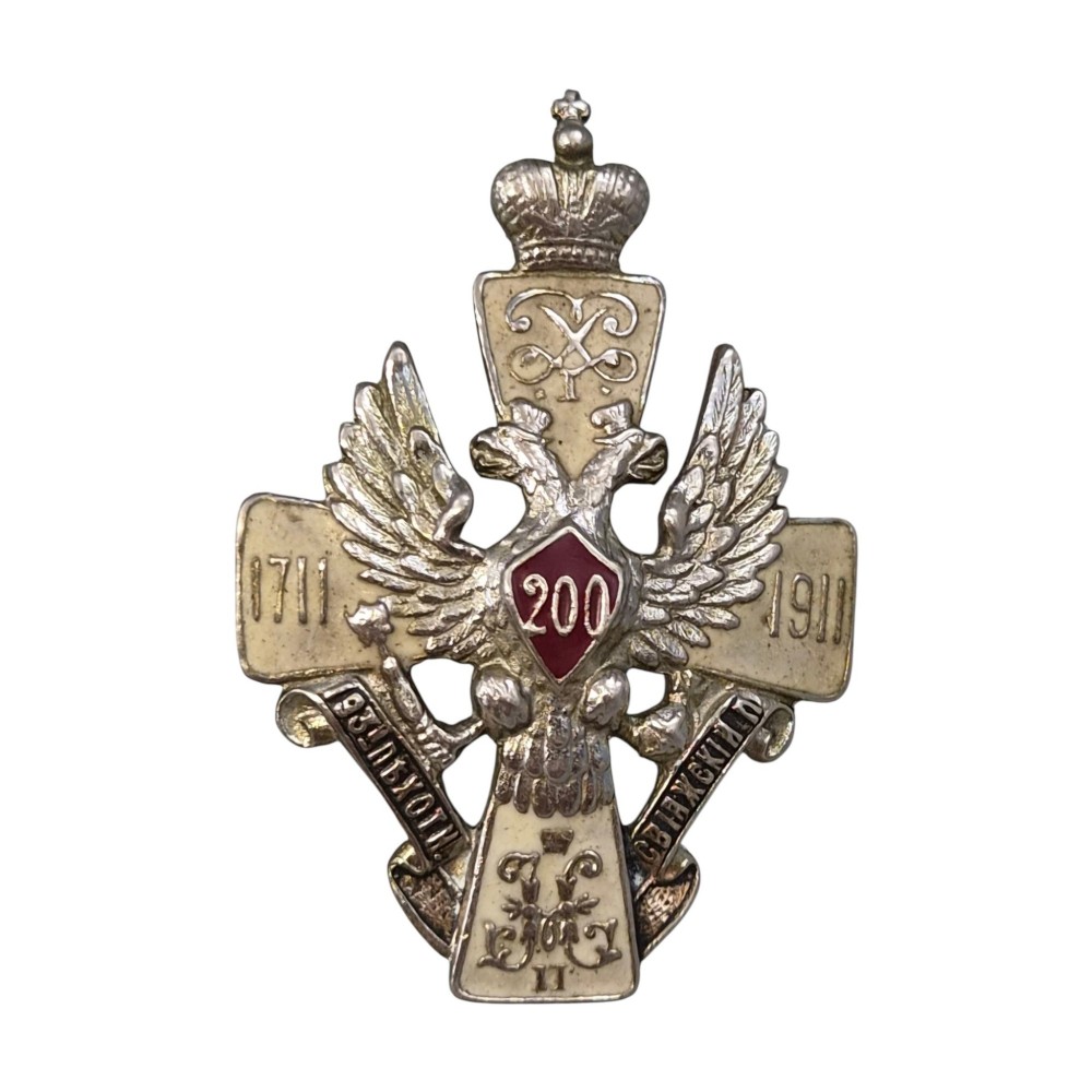 A rectangular Karelian birch box featuring a prominent silver and enamel Imperial Russian regimental badge mounted centrally on the lid. View XIII