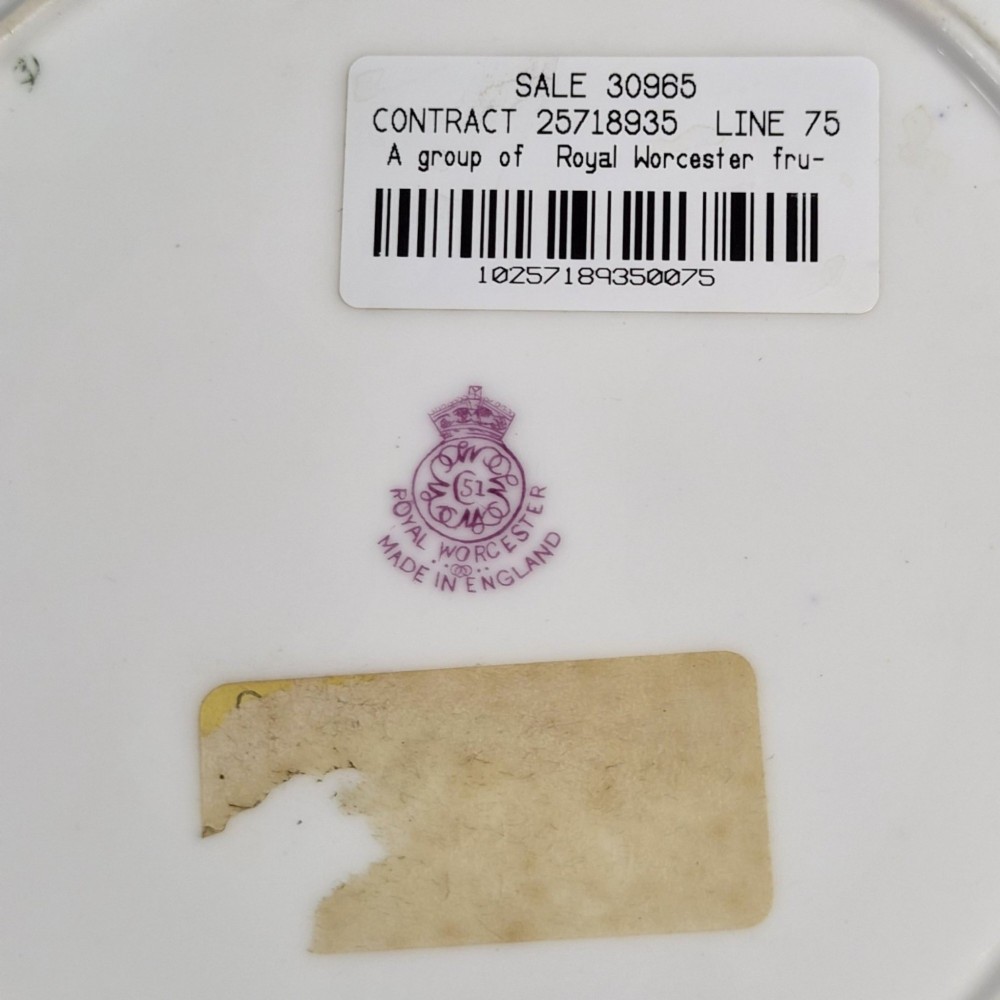 A circular porcelain cabinet plate featuring a central hand-painted fruit study surrounded by an ornate cobalt blue and heavily gilded scalloped rim. View VII
