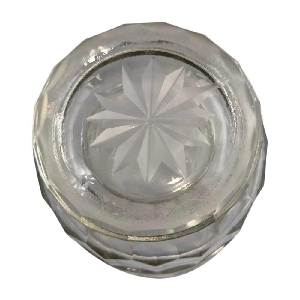 A large clear glass beaker featuring detailed wheel-engraved ceremonial iconography, vertical fluted panels near the lower rim, and a faceted base. View XII