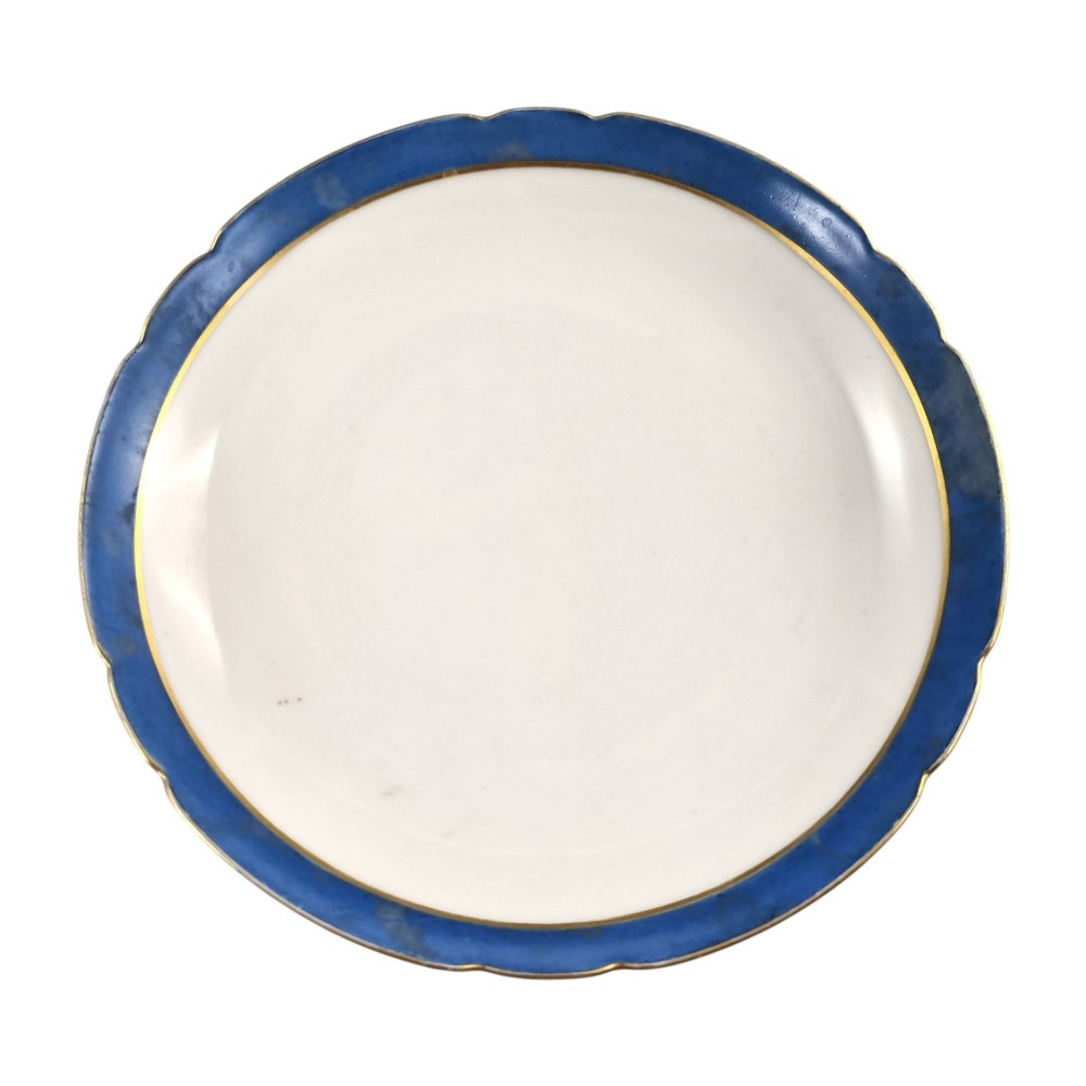 A cobalt blue and gilt porcelain tazza elevated on a pedestal base, adorned with a hand-painted winter landscape cartouche. View IV