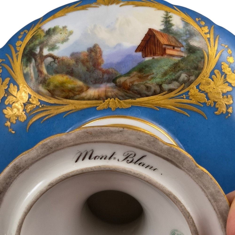 A cobalt blue and gilt porcelain tazza elevated on a pedestal base, adorned with a hand-painted winter landscape cartouche. View VIII