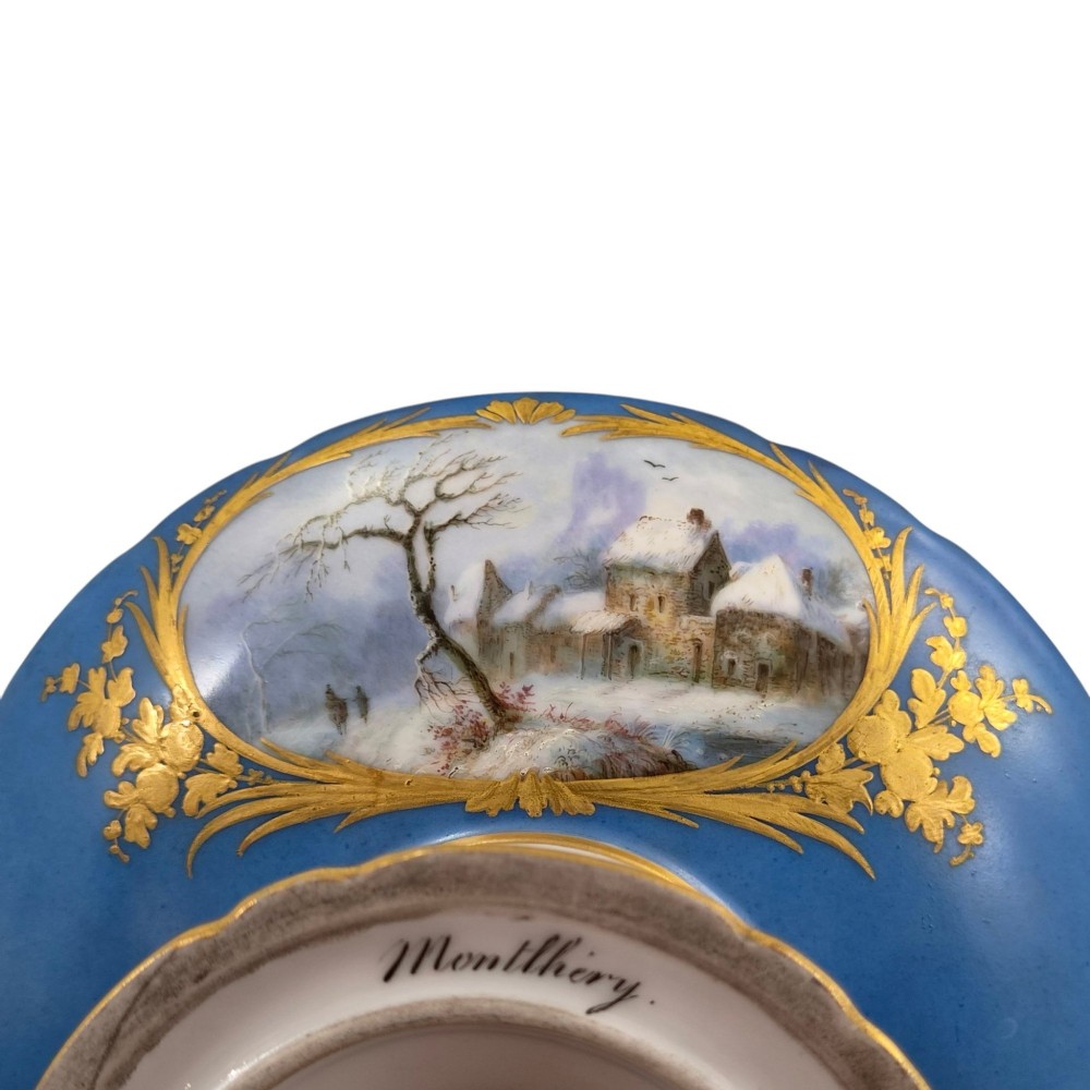A cobalt blue and gilt porcelain tazza elevated on a pedestal base, adorned with a hand-painted winter landscape cartouche. View IX