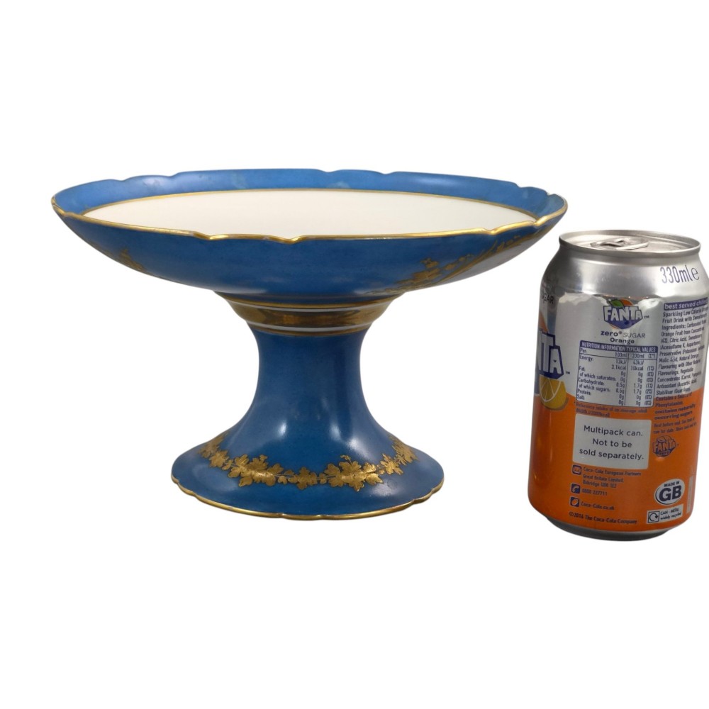 A cobalt blue and gilt porcelain tazza elevated on a pedestal base, adorned with a hand-painted winter landscape cartouche. View XIII