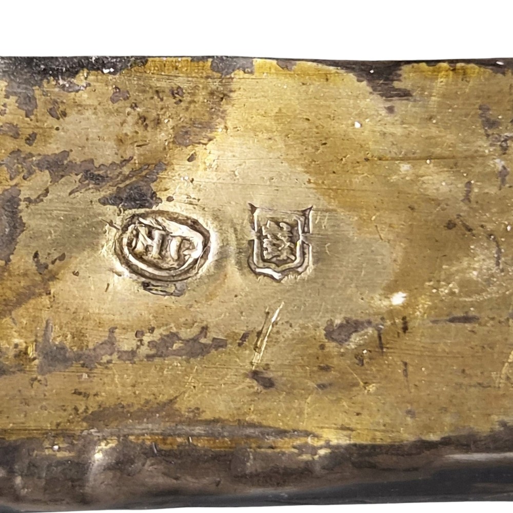 A rectangular antique Orthodox silver icon featuring repousse depictions of the Three Holy Hierarchs with detailed halos and Cyrillic script along the bottom edge. View XIV
