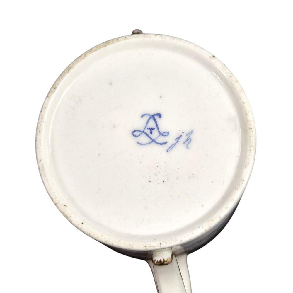 An 18th-century French Sevres soft-paste porcelain litron teapot decorated with hand-painted floral cartouches, gilding, and cobalt blue borders. View VII