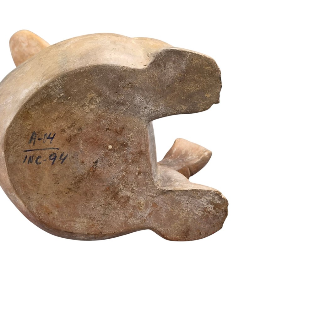 A pre-Columbian terracotta zoomorphic vessel featuring an animal form with painted geometric patterns around the neck and a integrated handle spout. View VII