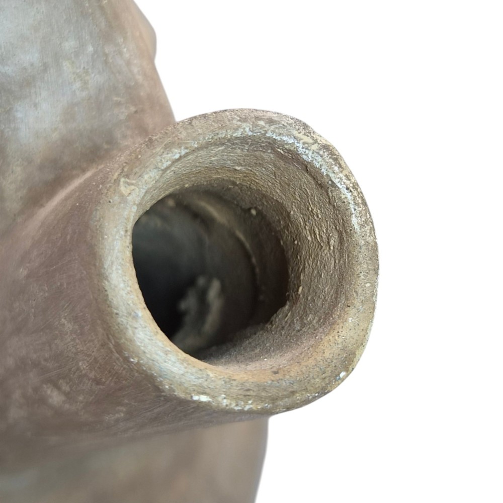 A pre-Columbian terracotta zoomorphic vessel featuring an animal form with painted geometric patterns around the neck and a integrated handle spout. View VIII