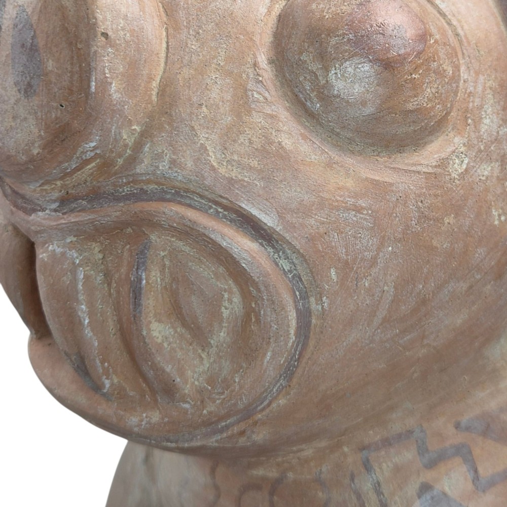 A pre-Columbian terracotta zoomorphic vessel featuring an animal form with painted geometric patterns around the neck and a integrated handle spout. View IX