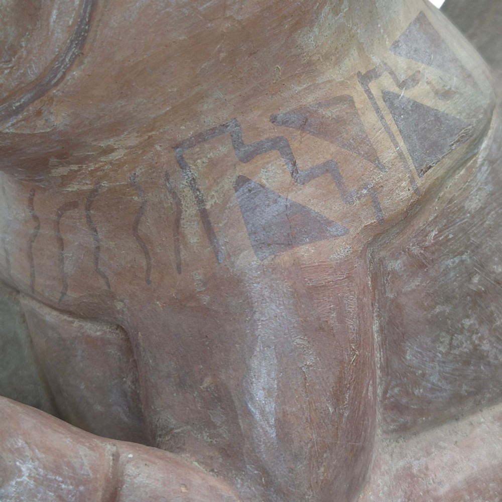A pre-Columbian terracotta zoomorphic vessel featuring an animal form with painted geometric patterns around the neck and a integrated handle spout. View XI