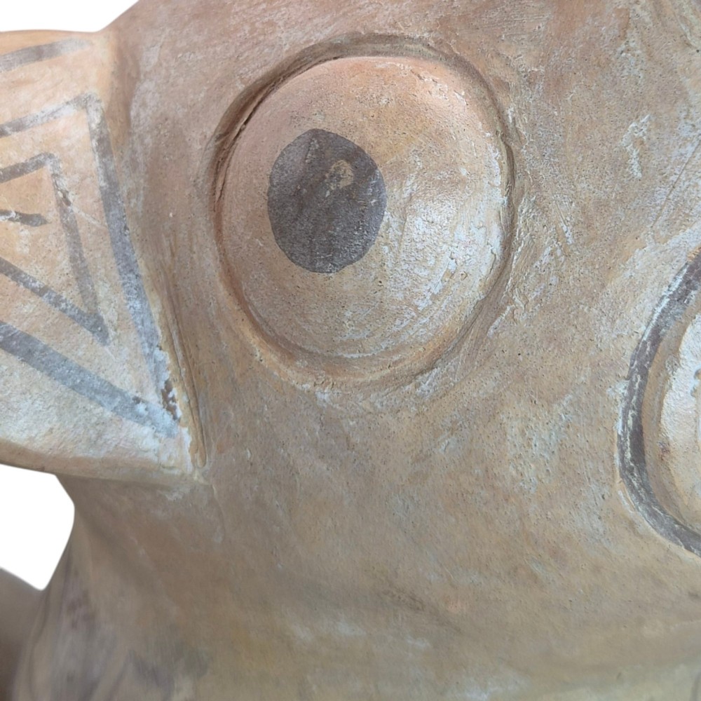 A pre-Columbian terracotta zoomorphic vessel featuring an animal form with painted geometric patterns around the neck and a integrated handle spout. View XIII