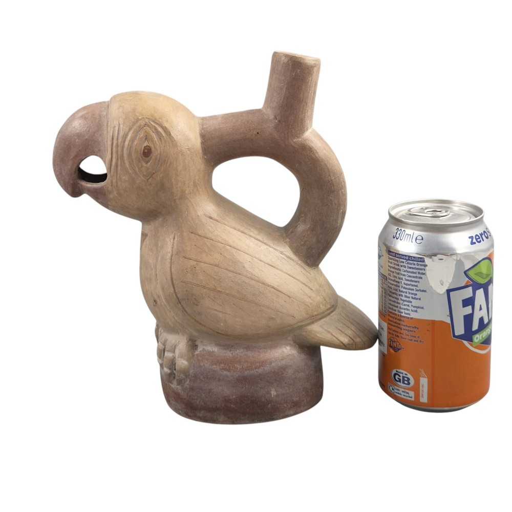 A beige terracotta Pre-Columbian stirrup spout vessel sculpted in the shape of a perched bird. View XI