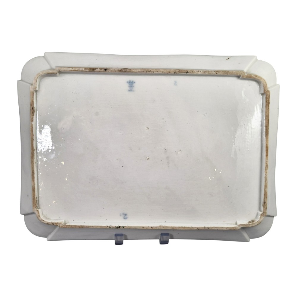 An eighteenth-century rectangular white porcelain serving tray featuring shaped corners, delicate gilded scrollwork borders, and a central hand-painted crowned monogram. View V