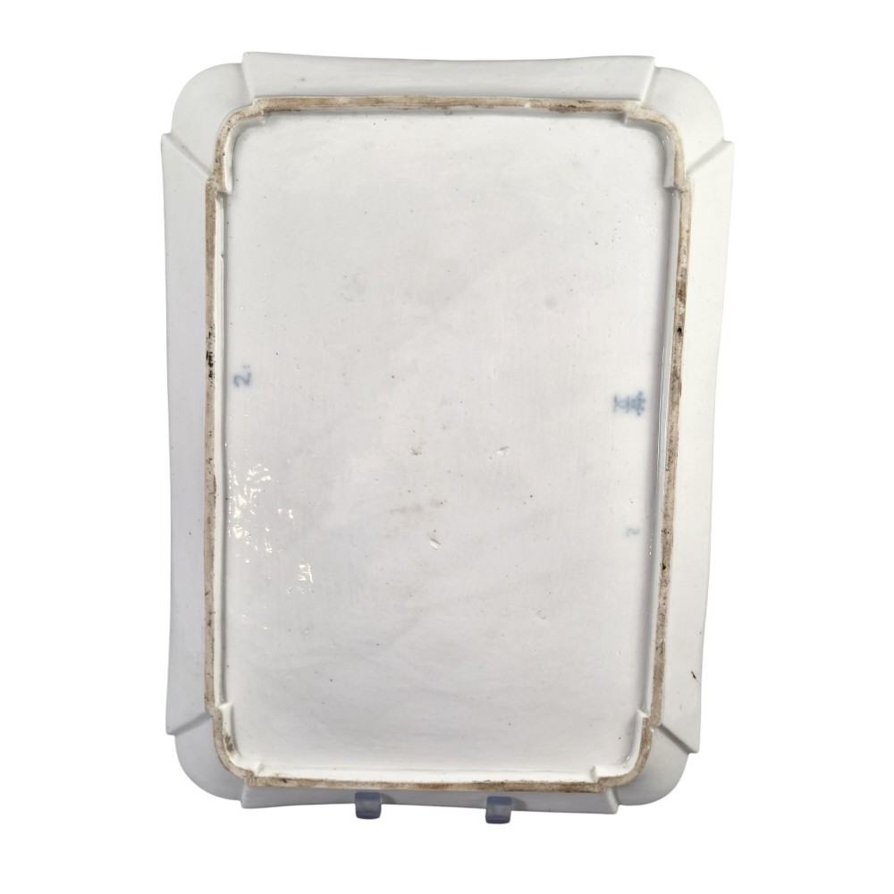An eighteenth-century rectangular white porcelain serving tray featuring shaped corners, delicate gilded scrollwork borders, and a central hand-painted crowned monogram. View IX