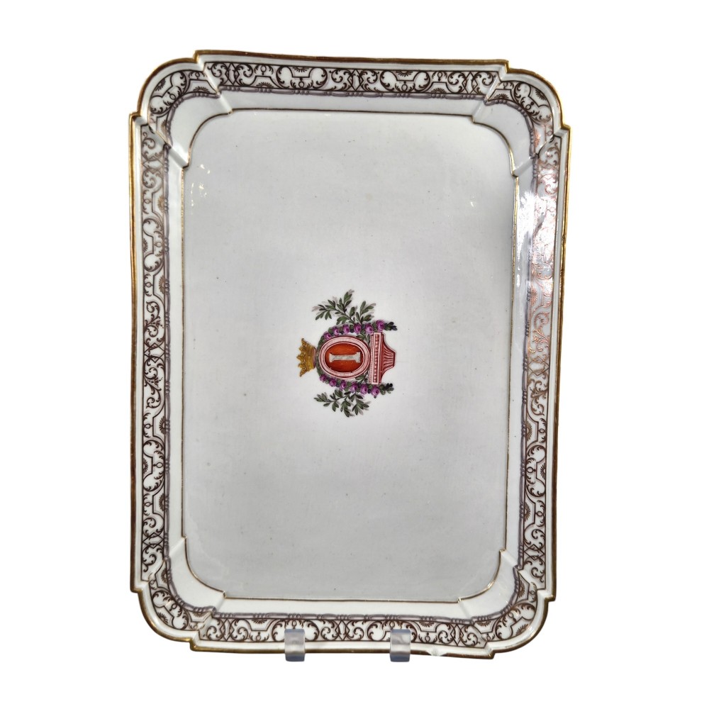 An eighteenth-century rectangular white porcelain serving tray featuring shaped corners, delicate gilded scrollwork borders, and a central hand-painted crowned monogram. View X