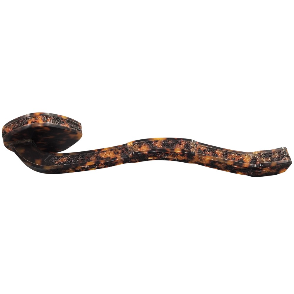A late 19th-century Chinese Qing Dynasty ruyi sceptre carved from translucent mottled amber and dark brown tortoiseshell with intricate relief carving along the handle and head. View IV