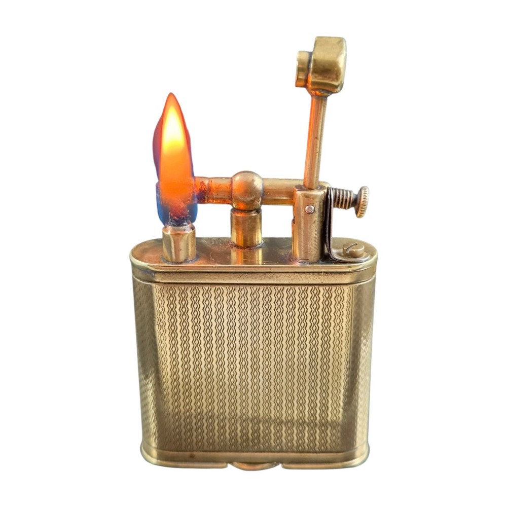 A 1920s Dunhill Unique gold-plated petrol lighter featuring an engine-turned pattern and a straight-arm lift mechanism. View XI