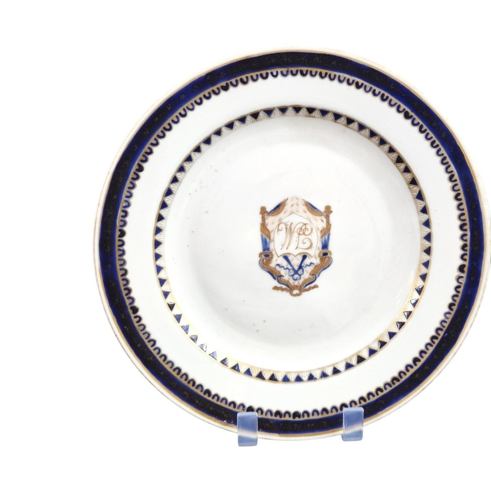 A five-piece late 18th-century Chinese export porcelain tea service featuring two cream jugs, two saucers, and a footed dish decorated with cobalt blue borders, gilt detailing, and central monograms. View VIII