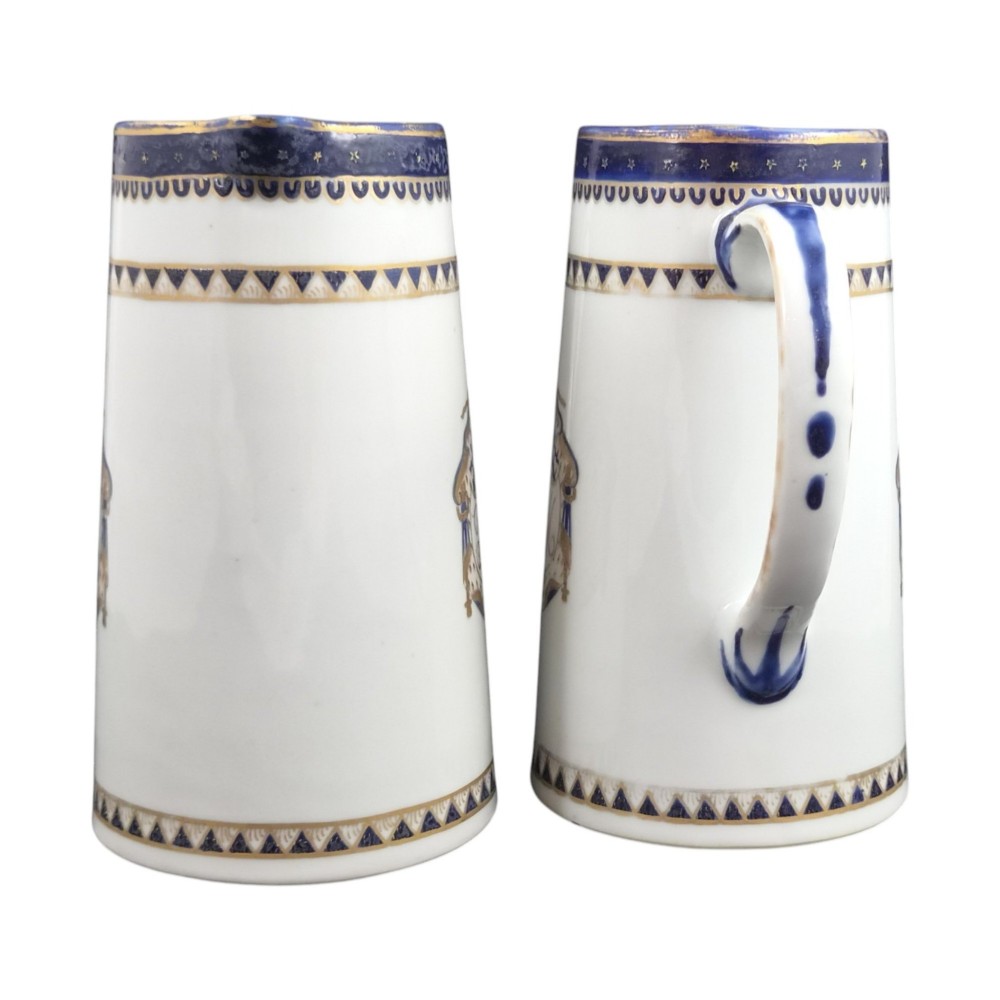 A five-piece late 18th-century Chinese export porcelain tea service featuring two cream jugs, two saucers, and a footed dish decorated with cobalt blue borders, gilt detailing, and central monograms. View XI