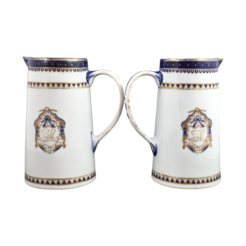 A five-piece late 18th-century Chinese export porcelain tea service featuring two cream jugs, two saucers, and a footed dish decorated with cobalt blue borders, gilt detailing, and central monograms. View XII