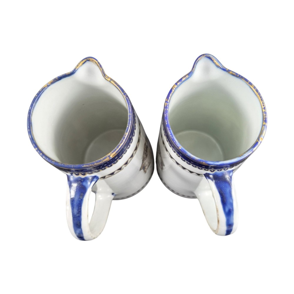 A five-piece late 18th-century Chinese export porcelain tea service featuring two cream jugs, two saucers, and a footed dish decorated with cobalt blue borders, gilt detailing, and central monograms. View XIV