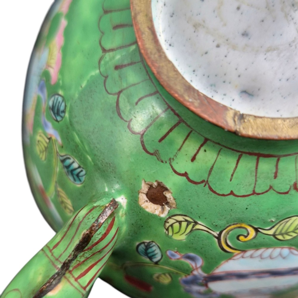 An eighteenth-century Chinese Canton enamel wine cup with green dragon-shaped handles resting on a matching round saucer, decorated with floral motifs and symbols. View VII