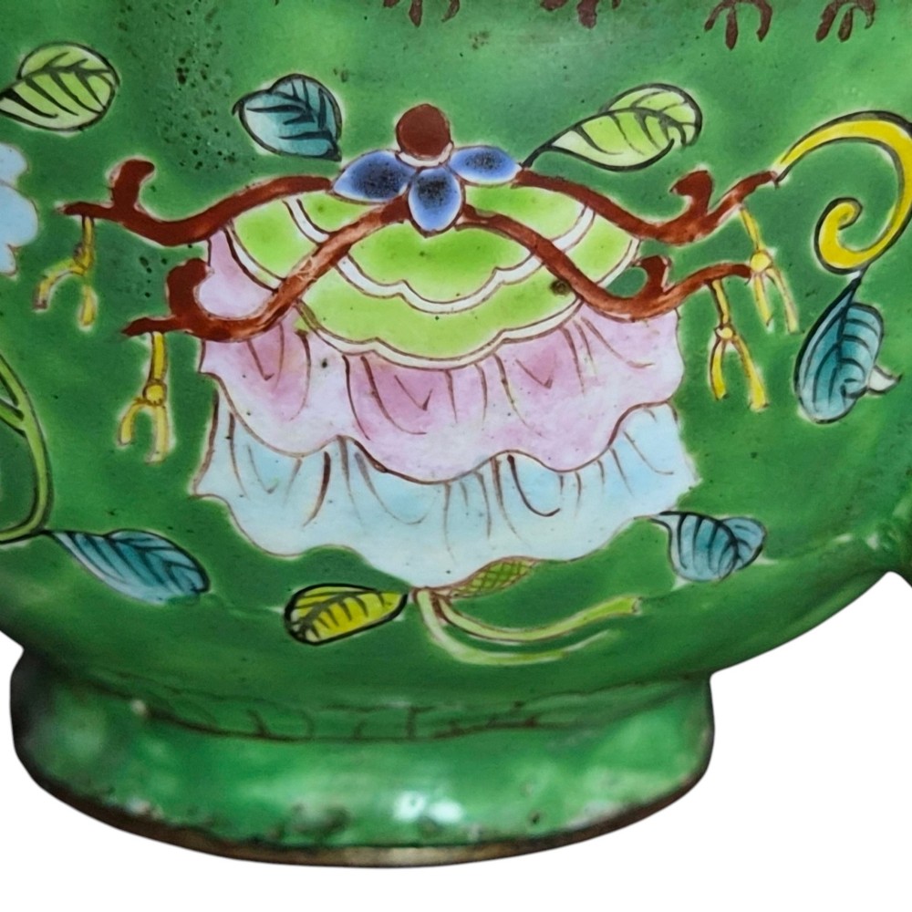 An eighteenth-century Chinese Canton enamel wine cup with green dragon-shaped handles resting on a matching round saucer, decorated with floral motifs and symbols. View XIII