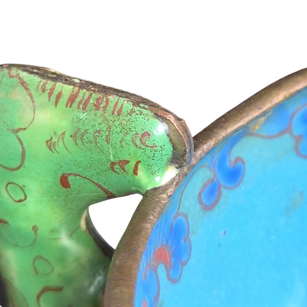 An eighteenth-century Chinese Canton enamel wine cup with green dragon-shaped handles resting on a matching round saucer, decorated with floral motifs and symbols. View XIV