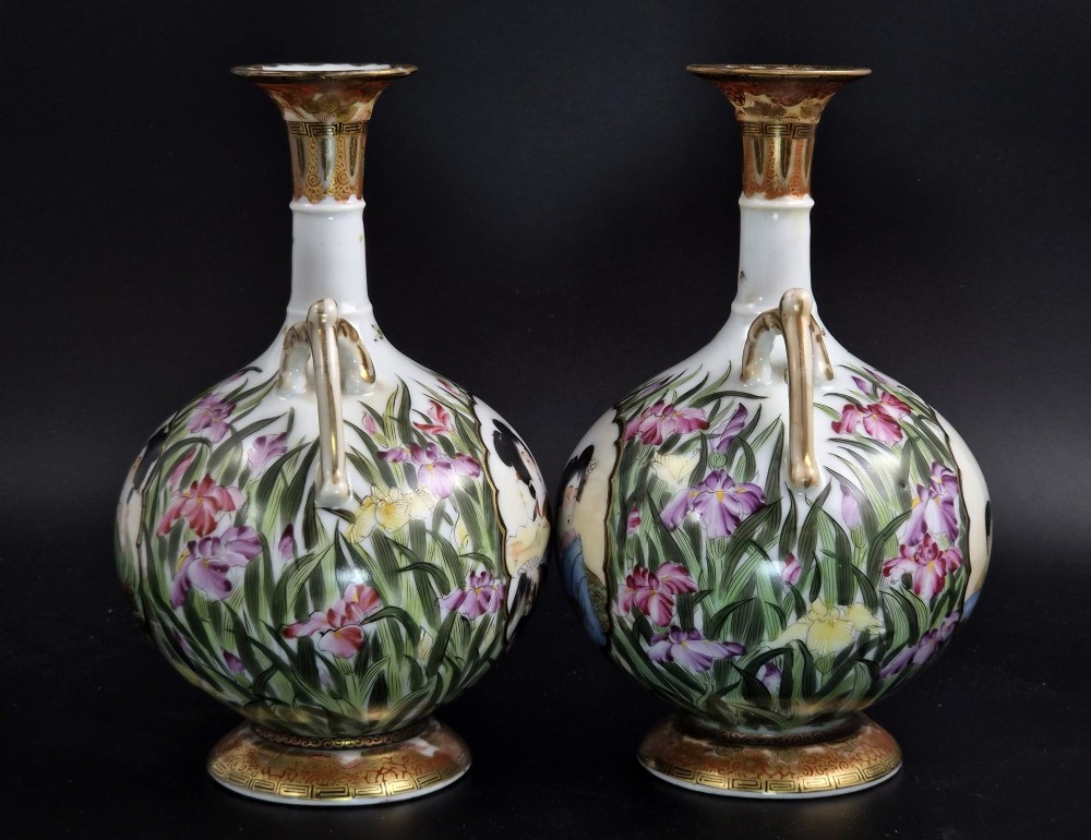 A pair of Japanese Yokohama porcelain vases decorated with hand-painted figures, floral irises, twin gilt handles, and gilded neck details. View IV
