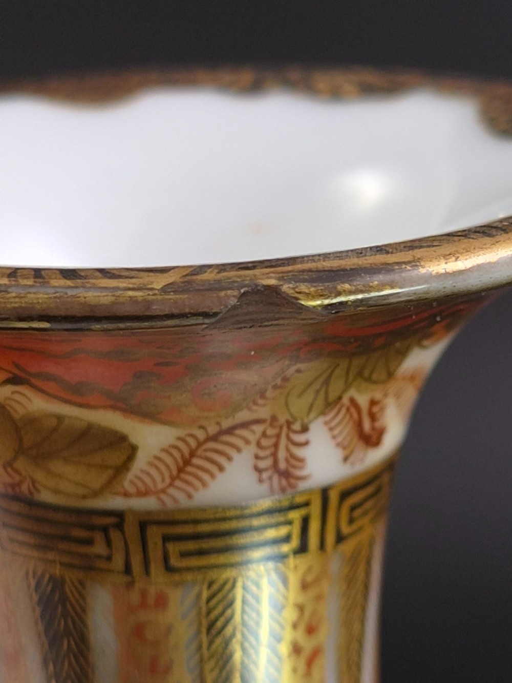 A pair of Japanese Yokohama porcelain vases decorated with hand-painted figures, floral irises, twin gilt handles, and gilded neck details. View VIII