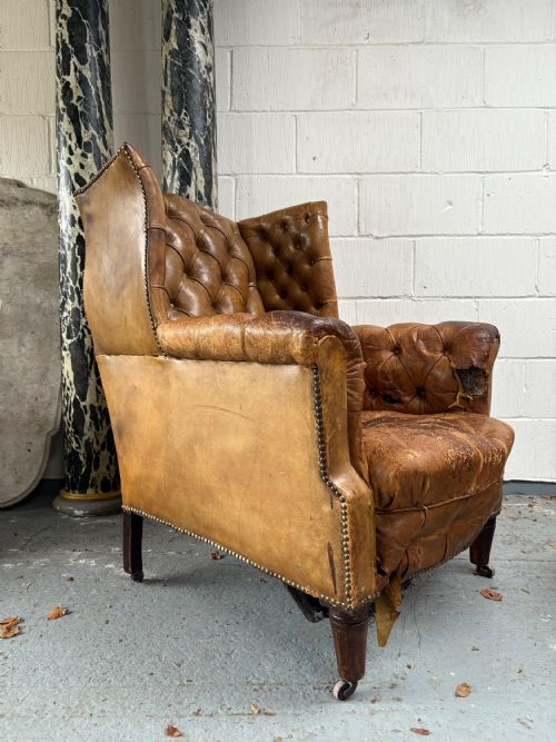 AN EDWARDIAN BUTTON AND STUDDED LEATHER ANTIQUE WING BACK ARM CHAIR C1910 - ADDITIONAL PHOTO 1