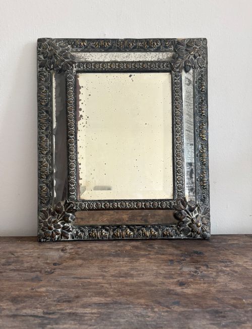 a 19th century dutch repousse brass cushion mirror 39cm with foxed mercury plate - CATEGORY: ANTIQUE MIRRORS - DATED 19TH CENTURY