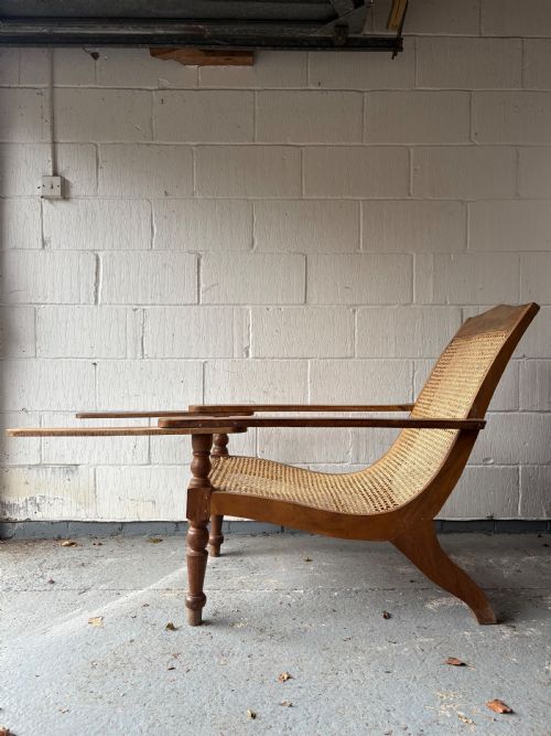 A PAIR OF ORIGINAL ANGLO INDIAN TEAK AND CANE PLANTATION CHAIRS CIRCA 19101920 - ADDITIONAL PHOTO 1