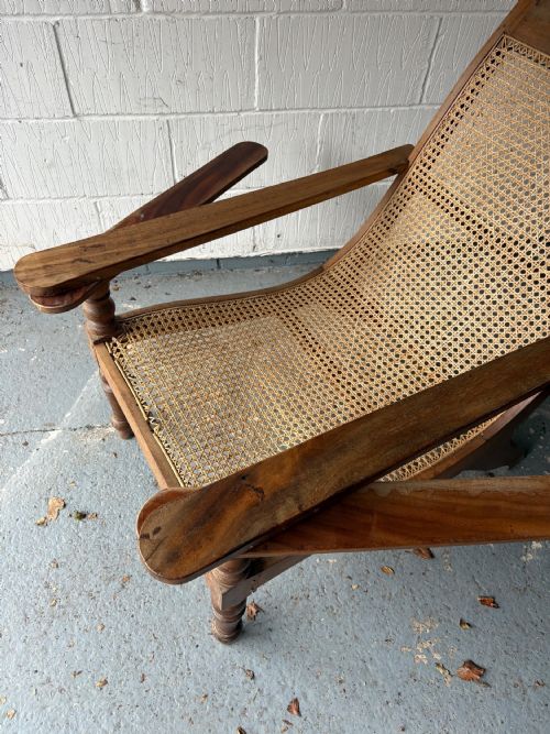 A PAIR OF ORIGINAL ANGLO INDIAN TEAK AND CANE PLANTATION CHAIRS CIRCA 19101920 - ADDITIONAL PHOTO 4