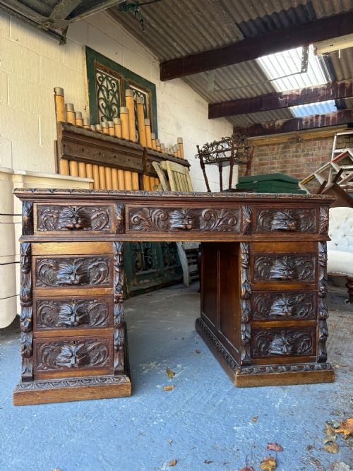 A 19TH CENTURY CARVED OAK FLEMISH STYLE GREEN MAN PARTNERS DESK 122CM C1880 - ADDITIONAL PHOTO 1