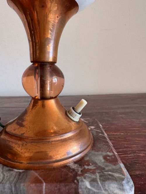 fig 2. A small French Art Deco table lamp featuring a spherical white opaline glass shade atop a turned copper stem mounted on a square veined marble base.