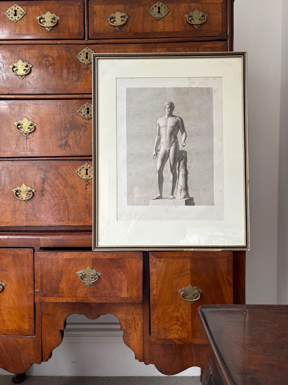 A pair of framed monochrome 19th-century classical engravings depicting ancient male sculptures mounted in cream mats. View XII