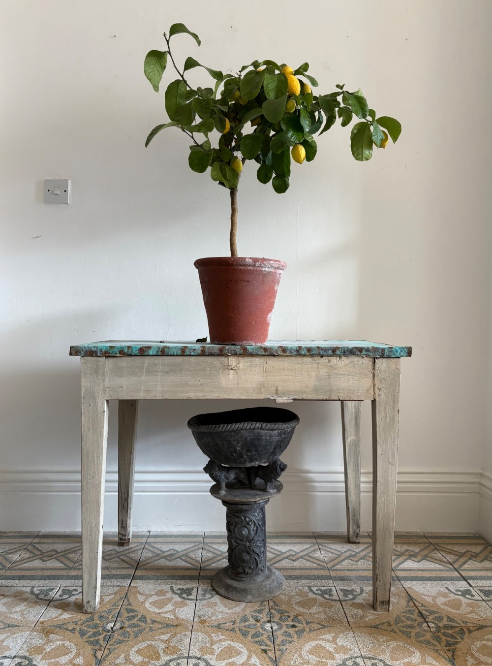 A French circa 1900 rustic wooden table with tapered legs and a verdigris copper sheet top edged with metal tacks. View VII