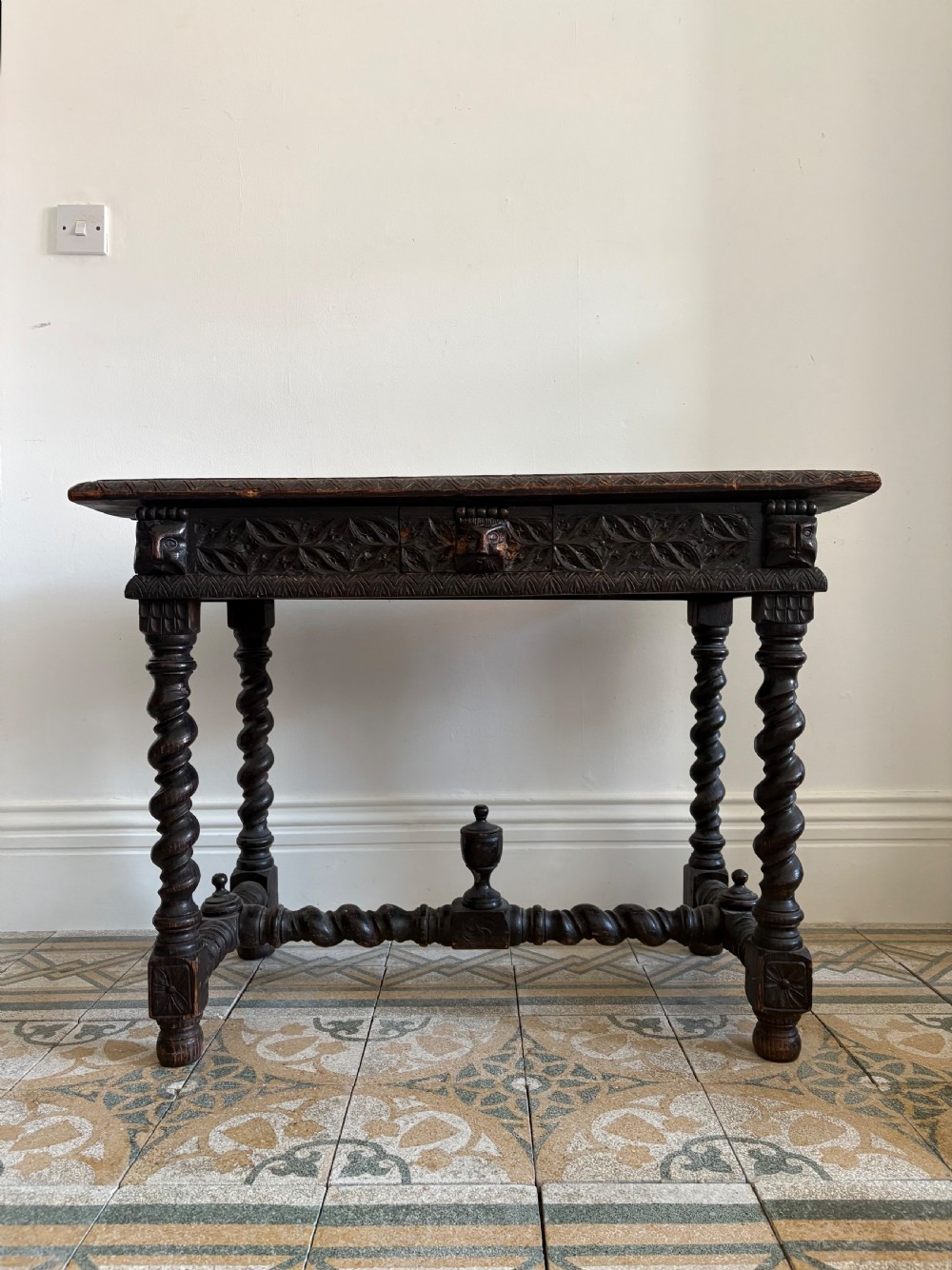 A 17th century Flemish carved oak side table with barley twist , grotesque masks and up finial, 97cm View V