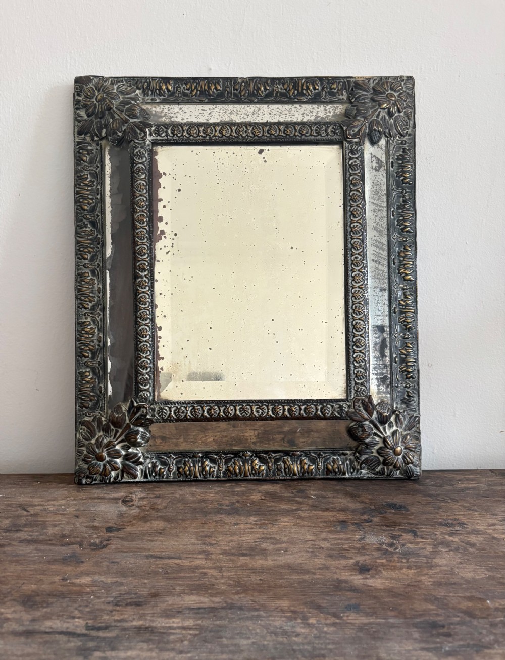A 19th Century Dutch Repousse Brass Cushion Mirror 39cm with Foxed Mercury Plate