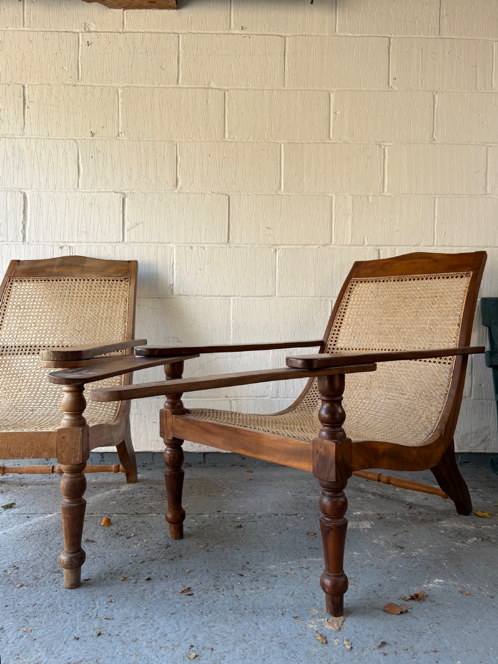 A Pair of Original Anglo Indian Teak and Cane Plantation Chairs circa 1910-1920