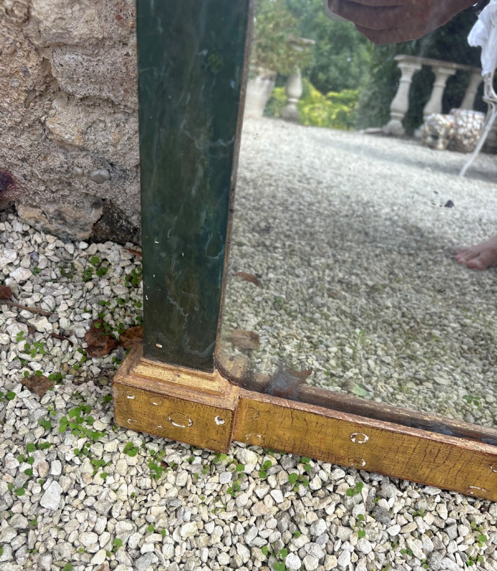An early 19th-century Neoclassical rectangular wall mirror featuring a giltwood cornice and base flanking green faux-marble painted pilasters and frieze. View XII