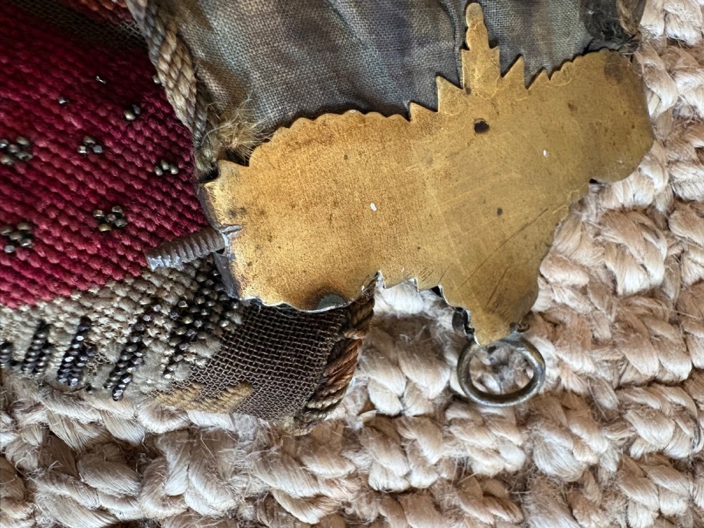A long 19th-century hand-embroidered silk and beadwork bell pull featuring floral designs and cast brass end fittings with a lower ring. View XIV