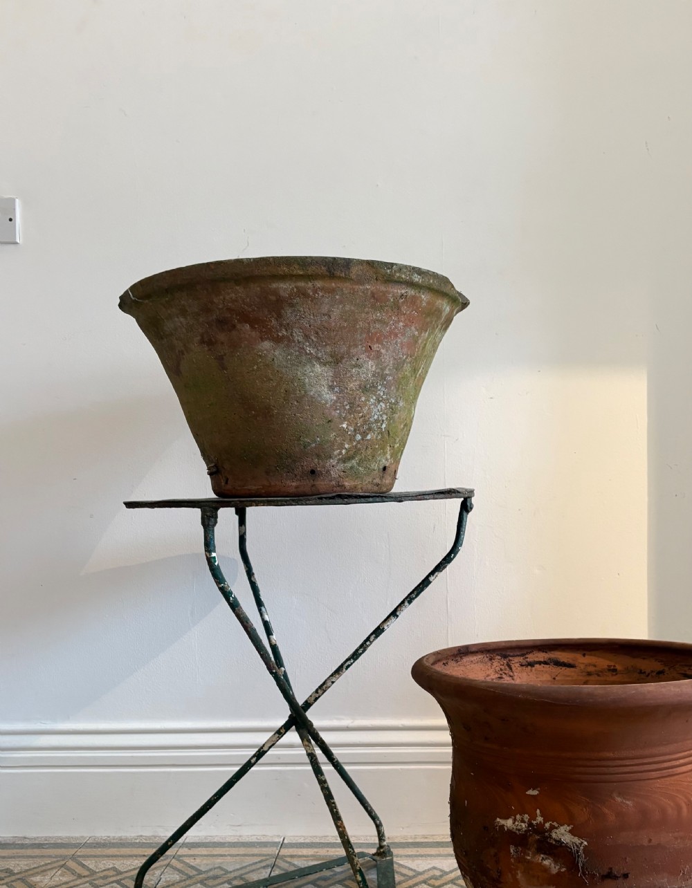 A large 19th-century circular terracotta dairy bowl featuring a dark glazed interior and weathered, unglazed exterior surface. View III