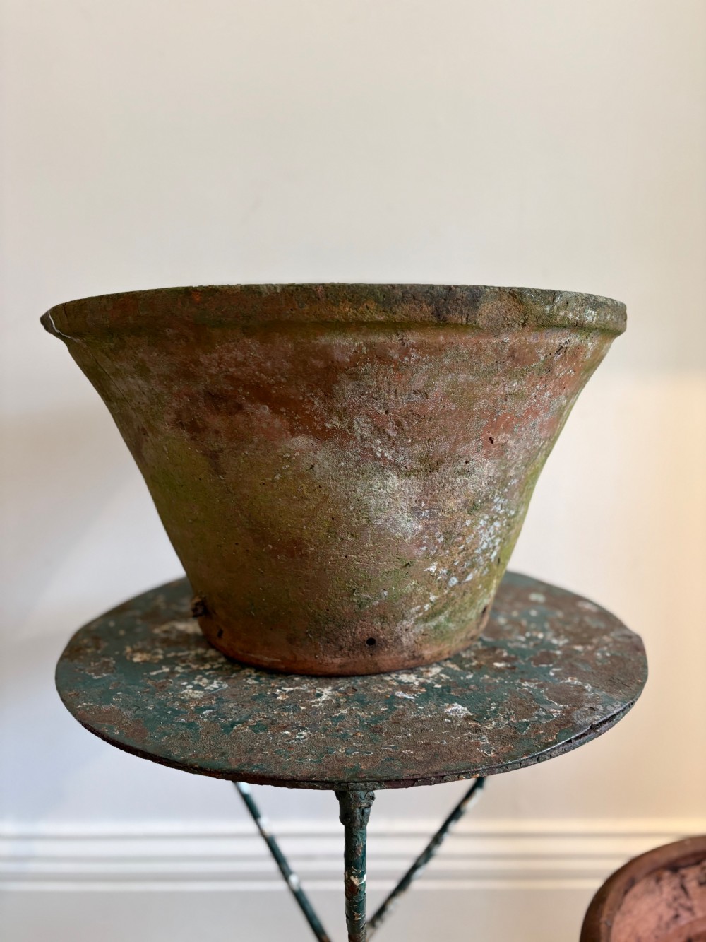 A large 19th-century circular terracotta dairy bowl featuring a dark glazed interior and weathered, unglazed exterior surface. View IX