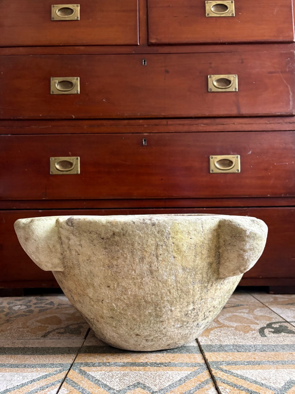A large 18th-century carved white marble mortar featuring four thick corner lugs and a weathered, textured outer surface. View IV