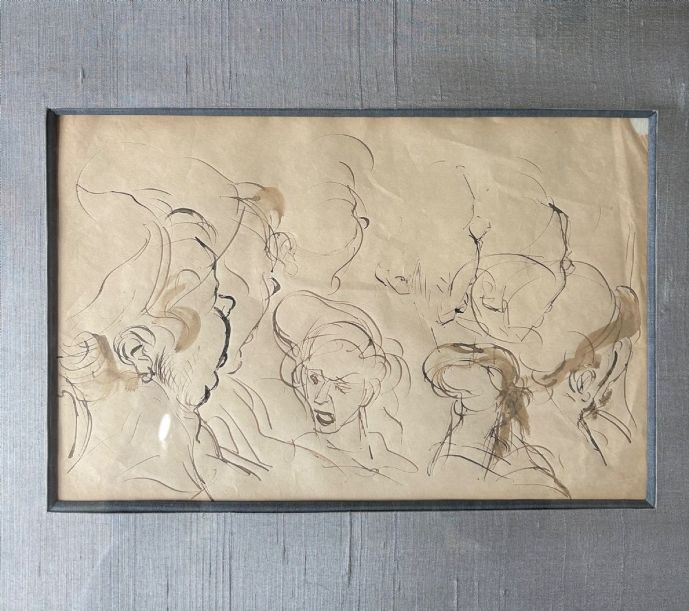 A framed 19th-century sepia pen and ink preparatory drawing depicting expressively sketched head studies on aged paper. View XII