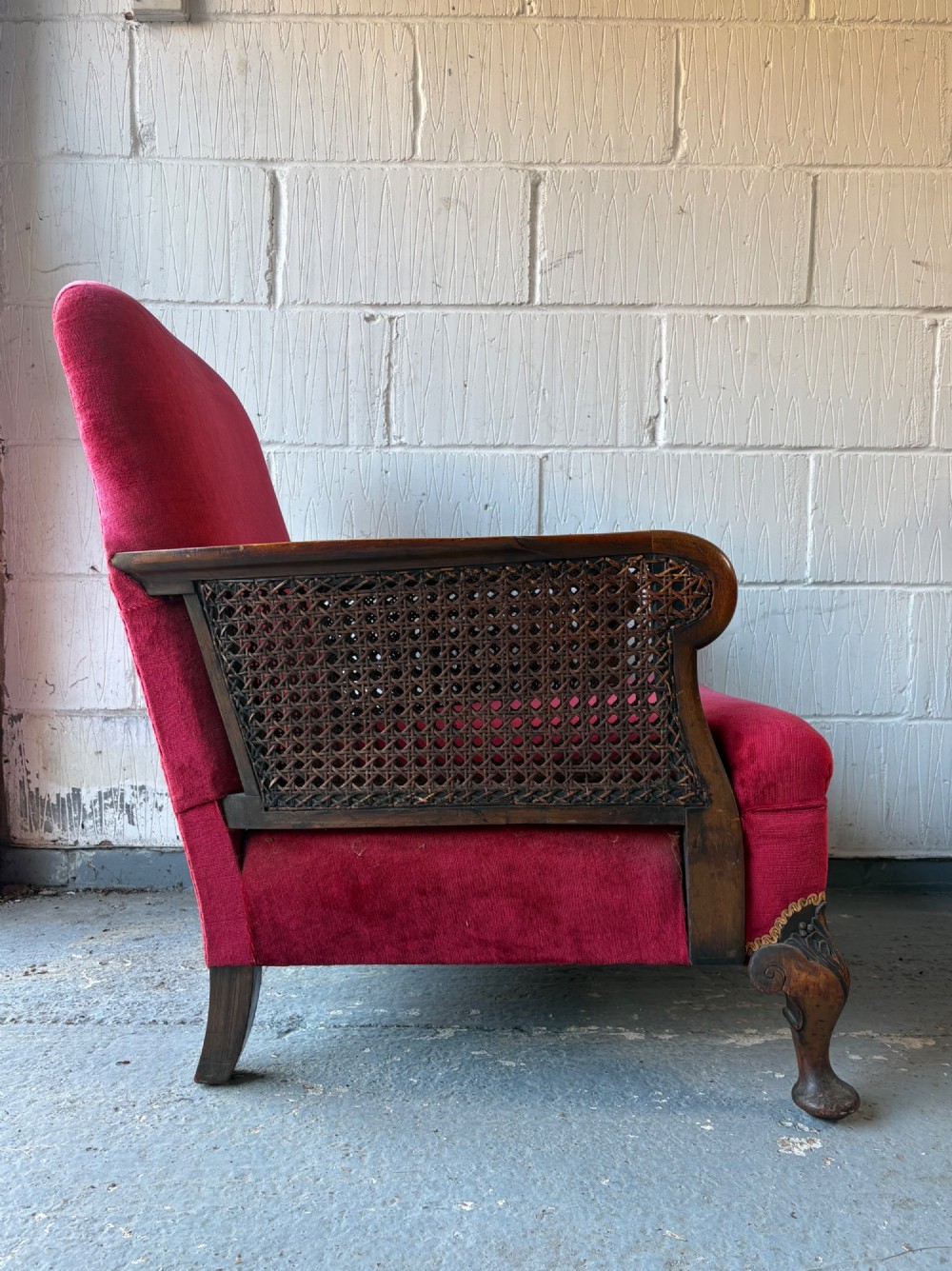 An Early 20th Century Walnut and Red Velvet Bergere Arm Chair C1900-1910