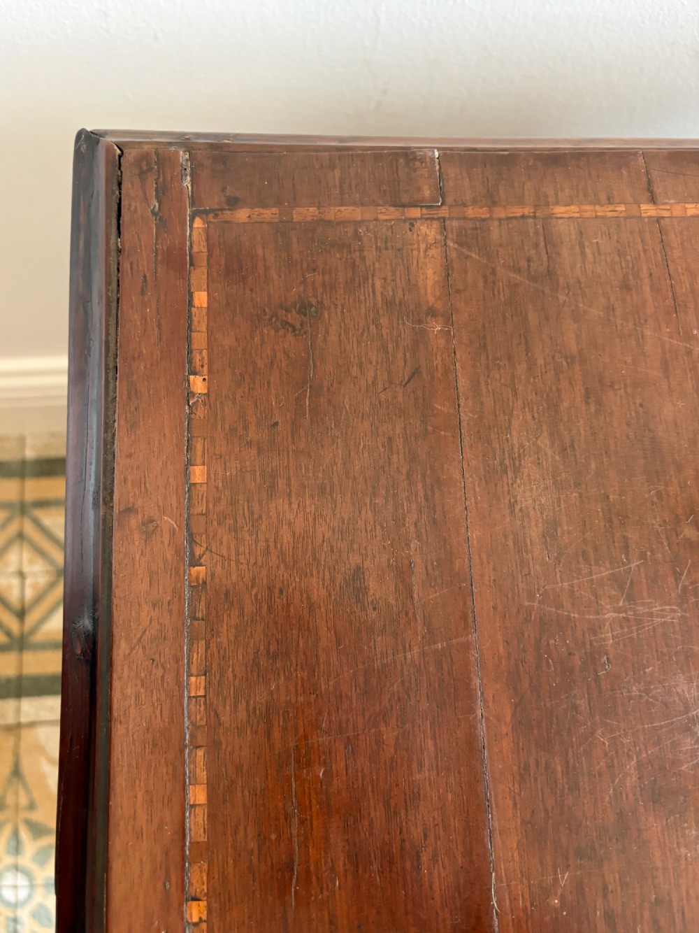 A mid-18th-century Georgian walnut chest of drawers featuring a two-over-three drawer layout, brass handles with backplates, and bracket feet. View XII