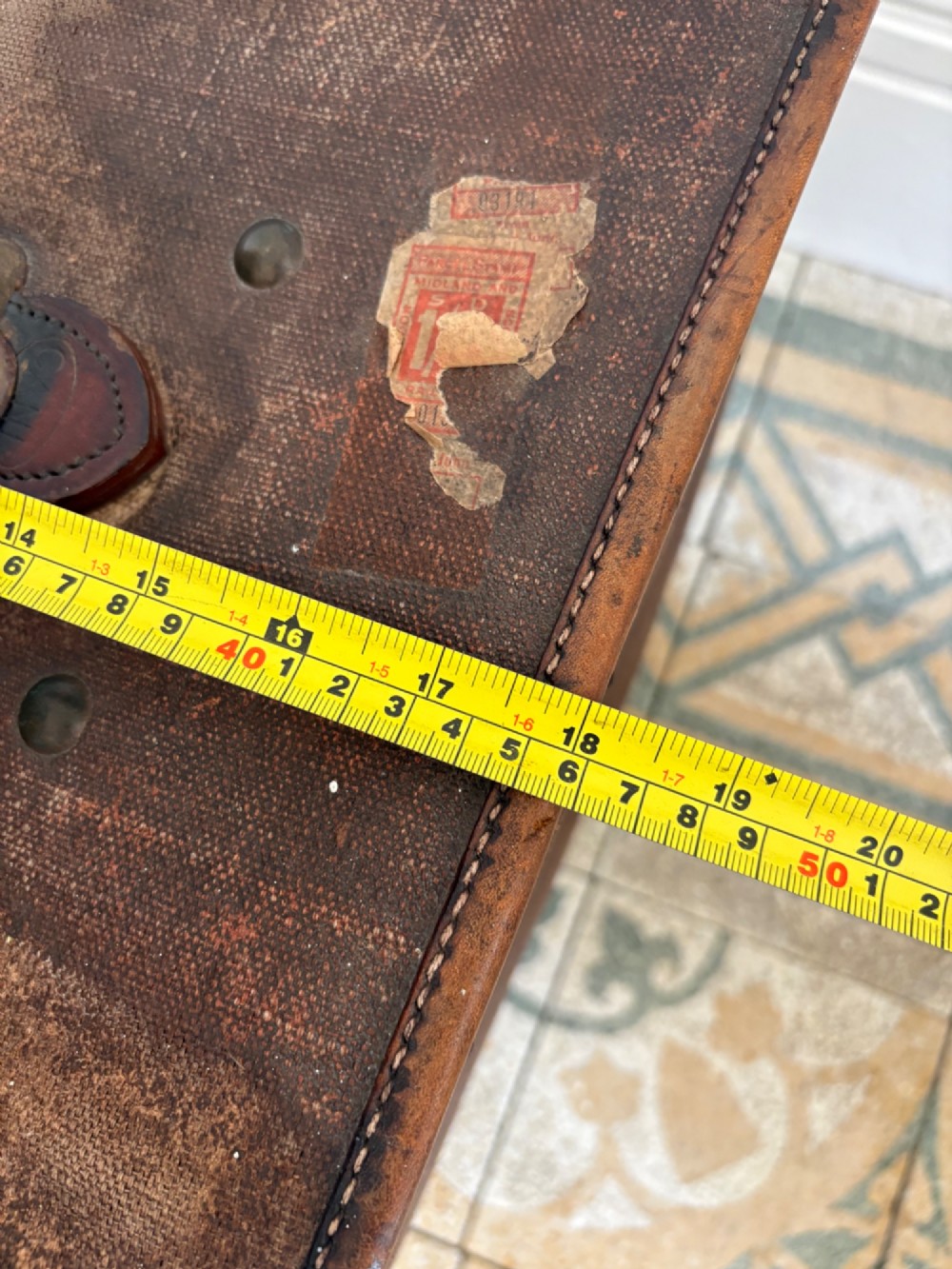 An Edwardian brown canvas and leather hat box trunk featuring brass latches, stitched leather trim, and an ocean liner travel label on the front. View XIII